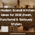 Luxury modern Scandi kitchen for 2026, full room view, warm light oak cabinets with visible natural wood grain, quartz waterfall island, oversized statement wall art in premium oak frames, integrated appliances, black metal open shelving, white ceramic dishes, artisan pottery, designer books, brushed brass hardware, matte black faucet, statement zellige tile backsplash, opal glass pendant lights, white oak flooring, indoor olive tree, floor-to-ceiling windows with sheer linen curtains, abundant golden-hour sunlight, cozy hygge atmosphere, luxury Nordic interior, contemporary Scandinavian kitchen design, Architectural Digest style, Pinterest-worthy home inspiration, premium wood finishes, ultra-realistic editorial photography, no people, 8K detail.